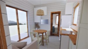 Olecko - Nowoczesny domek modułowy z jasnym wnętrzem, wyposażony w stół i krzesła, idealny jako domek mobilny lub dom mobilny. Przestronny salon z dużymi oknami zapewnia naturalne światło, co sprawia, że to doskonały wybór na wypoczynek w domach modułowych.