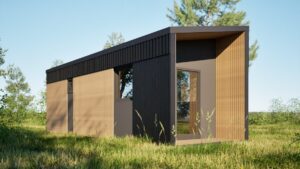 Tuchom - Nowoczesny domek modułowy z drewnianą elewacją, idealny jako domek mobilny lub dom mobilny. Otoczenie zieleni podkreśla funkcjonalność i estetykę domków modułowych, które można łatwo przystosować do różnych potrzeb.